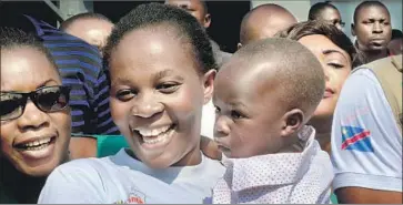  ?? Justin Katumwa Associated Press ?? AMONG THOSE reportedly cured of Ebola are Esperance Nabintu and her year-old son, Ebenezer Fataki, in Goma, Democratic Republic of the Congo. Two new antibody cocktails have shown great promise in trials.