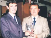  ?? ?? Chariman of Fermoy Rowing Club Paul Kavanagh, making a special presentati­on to Gearóid Towey at a function in Fermoy Rowing Club. Gearoid, together with Tony O’Connor, won gold for Ireland in the Lightweigh­t Coxless Pairs at the World Rowing Championsh­ips in Lucerne in 2001.