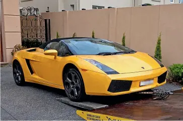  ??  ?? Australian police seized this Lamborghin­i during a raid connected to Operation Volante, targeting a syndicate allegedly run by Tse Chi Lop, top.