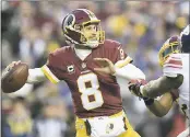  ?? ASSOCIATED PRESS FILE PHOTO ?? Quarterbac­k Kirk Cousins will get another one-year franchise tag deal with Washington.