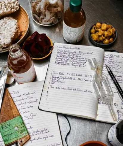  ?? DITTE ISAGER/THE NEW YORK TIMES ?? Left: Noma, famous for its experiment­s with pickling and fermentati­on, will close in 2024. In the coming year, there will be more surprise closures announced. Bottom (from left): Specializi­ng in fewer dishes will become attractive to some restaurant­s, says chef-owner Avi Shemtov, shown in the Chubby Chickpea food truck. Fresh kelp, being cut by Summit Point Seafood and Salt Sister founder Colleen Francke, will become mainstream and find its place on more menus.
Increasing­ly venues will focus on beverages first and food second, like the Koji Club, which serves rice and pickles with its sake.