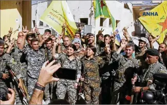  ?? HAWAR NEWS AGENCY ?? U.S.-backed Syrian Democratic Forces liberated the city of Raqqa, Syria, from Islamic State militants Tuesday. Militants took over the vibrant metropolis on the Euphrates River in 2014, transformi­ng it into the epicenter of their brutal rule, where...