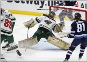  ?? JOHN WOODS — THE CANADIAN PRESS VIA AP ?? Wild goalie Marc-andre Fleury saves a shot from the Jets’ Kyle Connor, right, during Wednesday’s game in Winnipeg, Manitoba.