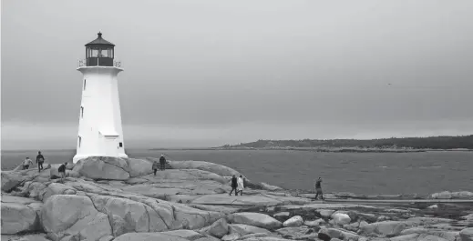  ?? PHOTOS BY DAN FELLNER/SPECIAL FOR THE REPUBLIC ?? The Peggy’s Point Lighthouse is 26 miles southwest of Halifax, Nova Scotia. Built in 1915, it's a working lighthouse and popular tourist attraction.