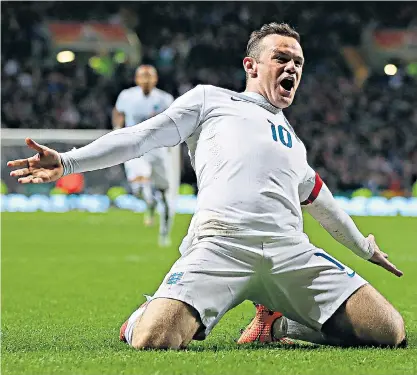  ??  ?? High point: Wayne Rooney celebrates scoring for England against Scotland in 2014; FA officials were surprised at how much the 3-1 victory meant to the players