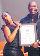  ?? ?? Beverly Moloko brags with her 10year service award she receives from Sammy Mokhele.