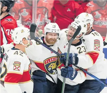  ?? ALEX BRANDON AP ?? Panthers players, from left, Gustav Forsling, Claude Giroux, Carter Verhaeghe and Aleksander Barkov show their emotions Friday after Giroux's goal in the second period against the host Capitals tied the score 2-2.