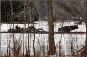  ?? (AP/Democrat & Chronicle/Tina MacIntyre-Yee) ?? The wreckage of a UH-60 Black Hawk medical evacuation helicopter sits in a field Thursday in Mendon, NY.