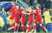  ?? ?? Liverpool players celebrate after their win over Everton