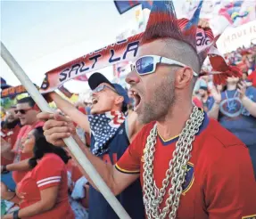  ?? JEFF SWINGER/USA TODAY SPORTS ?? Real Salt Lake fans show their spirit against Sporting Kansas City in an MLS game July 4 at Rio Tinto Stadium in Sandy, Utah.