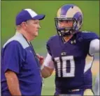  ?? PETE BANNAN — DIGITAL FIRST MEDIA ?? West Chester University head coach Bill Zwaan talks with quarterbac­k Paul Dooley in the first half of the Golden Rams’ 51-9 victory over Bentley Thursday evening at Farrell stadium.