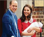  ?? JACK TAYLOR / GETTY IMAGES ?? Prince William and Catherine, Duke and Duchess of Cambridge, pose for photos with their new baby boy at St. Mary’s Hospital on Monday in London.