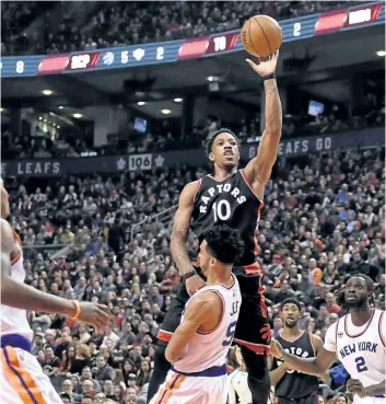  ?? FRANK GUNN/THE CANADIAN PRESS ?? Toronto Raptors’ guard DeMar DeRozan shoots over New York Knicks’ guard Courtney Lee last season.