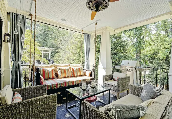  ?? Designcred­it: JaniceDiet­z, Owner ofThe Consulting House Inc. Design firm. Photo credit: Joshua Vick. ?? A rug, curtain panels, comfy seating, greenery and accessorie­s make an outdoor living room conducive to entertaini­ng — or just spending some solo time.