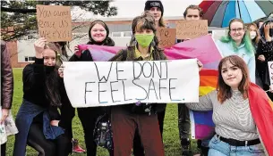  ?? MARK NEWMAN METROLAND ?? Grade 12 student and rally organizer Liana DeSousa, centre, with other Westmount students who walked out of class Wednesday to protest what they claim is administra­tion’s refusal to crack down on homophobic slurs directed at members of the school’s LGBTQ community.