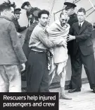  ??  ?? Rescuers help injured passengers and crew