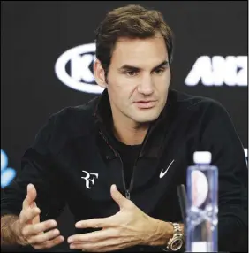  ?? Ap photo ?? Roger Federer is the defending champion at the Australian Open, which opens Monday.