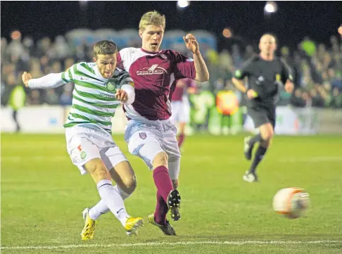  ?? ?? BIG OCCASION: Colin Hamilton, right, challenges Celtic’s Adam Matthews in a Scottish Cup tie from 2012.