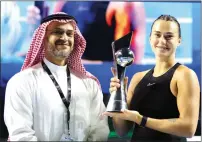  ?? — REUTERS FILE ?? Belarus’ Aryna Sabalenka poses with the trophy after winning her exhibition match against Tunisia’s Ons Jabeur in Riyadh last year.