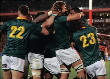  ?? Picture: SIPHIWE SIBEKO, REUTERS ?? RUDY YOU BEAUTY: The Springboks congratula­te Rudy Paige after his try at Ellis Park.