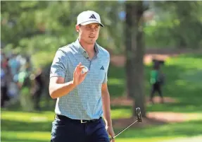  ?? ROB SCHUMACHER/USA TODAY NETWORK ?? Ludvig Aberg acknowledg­es the gallery after a birdie putt on No. 7 during the final round of the Masters tournament.