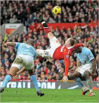  ?? ?? Derby delight: Rooney’s 2011 overhead kick AFP Wild: Bowyer and Dyer in 2005