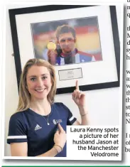  ??  ?? Laura Kenny spots a picture of her husband Jason at the Manchester Velodrome