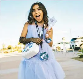  ?? ?? Ahzalina, who got tickets for the opening night of Olivia Rodrigo’s Guts World Tour as a 10th birthday gift, sports her outfit Feb. 23 outside the Acrisure Arena in Palm Springs, California.