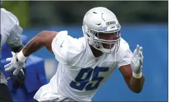  ?? PAUL SANCYA — THE ASSOCIATED PRESS ?? Detroit Lions defensive end Romeo Okwara runs a drill during a practice last year in Allen Park.