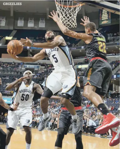  ?? NIKKI BOERTMAN/THE COMMERCIAL APPEAL ?? Grizzlies’ rookie guard Andrew Harrison (5) started and played 38 minutes in Wednesday’s season-opening victory over the Timberwolv­es.