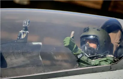  ?? PTI ?? Defence Minister Nirmala Sitharaman gestures from a Sukhoi-30 MKI before taking off for a sortie in Jodhpur on Wednesday. —