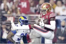  ?? AP photo ?? Niners safety Jimmie Ward intercepts a pass intended for the Rams’ Odell Beckham Jr. in the first half Monday.