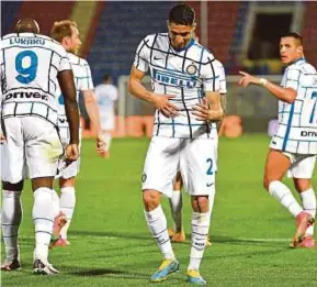  ?? . EPA PIC ?? Inter’s Achraf Hakimi (centre) celebrates after scoring during their Serie A match against Crotone on Saturday.