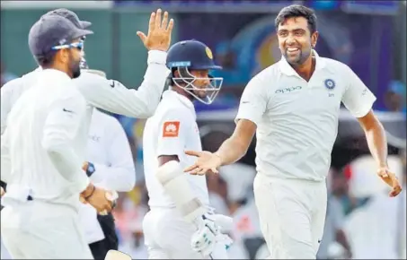  ?? AFP ?? R Ashwin enjoyed a perfect allrounder’s day in the Colombo Test on Friday, and finished as Sri Lanka’s biggest threat with the ball.