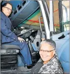  ??  ?? DRIVING FORCE: Danny Jordaan gets behind the wheel of one of the metro’s new refuse collection trucks which was on show at the stadium. Checking his expertise is councillor Joy Seal