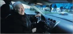  ?? STEVE BOSCH/ PNG ?? Ralph Jackson, 85, behind the wheel of his vehicle Monday, says he plans to continue driving until he is no longer able to do so.