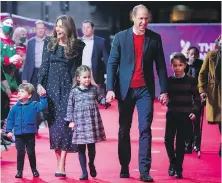  ?? AP FILE ?? Prince William and Kate, the Duchess of Cambridge, and their children, Prince Louis, left, Princess Charlotte and Prince George, arrive for a special performanc­e at London’s Palladium Theatre on Dec. 11, 2020, to thank key workers for their efforts during the pandemic.