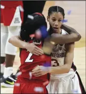  ??  ?? TOP PICKS? Arizona guard Aari McDonald (2) gets a hug from Stanford guard Anna Wilson (3) at the end of the championsh­ip game in the women’s Final Four NCAA college basketball tournament on April 4 at the Alamodome in San Antonio.