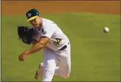  ?? ERIC RISBERG — THE ASSOCIATED PRESS ?? A’s pitcher Jesus Luzardo throws against the White Sox during the first inning of Game 1 of their American League wild-card series on Tuesday in Oakland.