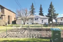  ??  ?? Futurists are predicting that backyard gardens, like this one in West Hillhurst, may rise in popularity amid food security concerns.