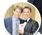  ??  ?? John Barrowman with husband Scott after being awarded an MBE in 2014