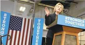  ?? JAY LAPRETE/ASSOCIATED PRESS ?? Democratic presidenti­al candidate Hillary Clinton challenged presumed opponent Donald Trump on Tuesday during a speech. She criticized his business acumen at an appearance at Fort Hayes Vocational School in Columbus, Ohio.