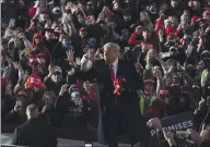  ?? ALEX BRANDON — THE ASSOCIATED PRESS ?? President Donald Trump throws a hat to supporters at a campaign rally at Pittsburgh-Butler Regional Airport on Saturday in Butler, Pa.