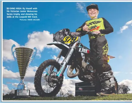  ?? Pictures: MARK WILSON ?? RY-DING HIGH: Ry Hazell with his Victorian Junior Motocross Series trophy and showing his skills at the Leopold MX track.