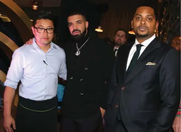  ?? JOHNNY NUNEZ/GETTY IMAGES FOR REMY MARTIN ?? Antonio Park, left, Drake and Nessel Beezer are in partnershi­p in the soon to open Pick 6ix restaurant at Yonge and Wellington Sts.