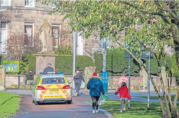  ??  ?? ON PATROL: Police maintain a presence in the South Inch after the vicious attack which put a teenager in hospital. Picture by Steve MacDougall.