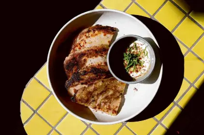  ?? Photos by Santiago Mejia/The Chronicle ?? Bar Jabroni’s scallion pancakes with date purée, green garlic and sesame oil come with whipped feta.