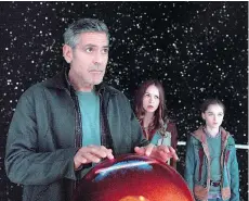  ??  ?? George Clooney, left, Britt Robertson and Raffey Cassidy star in Tomorrowla­nd. Clooney plays a former boy genius turned cynic.