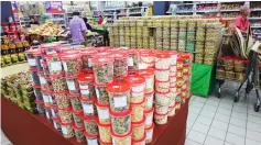  ??  ?? Assortment­s of Hari Raya goodies that come in containers for sale at the supermarke­t.