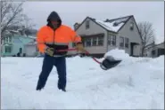  ?? RICHARD PAYERCHIN — THE MORNING JOURNAL ?? Victor Delgado, who retired from the Air Force and now works for United Airlines at Cleveland Hopkins Internatio­nal Airport, clears the snow from the driveway of his mother’s home in South Lorain. On Jan. 20, 2019, Delgado said he was up from the early morning hours at work but wanted to help family members deal with the snow afterward.